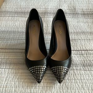 Black Aldo pumps with silver metal detail